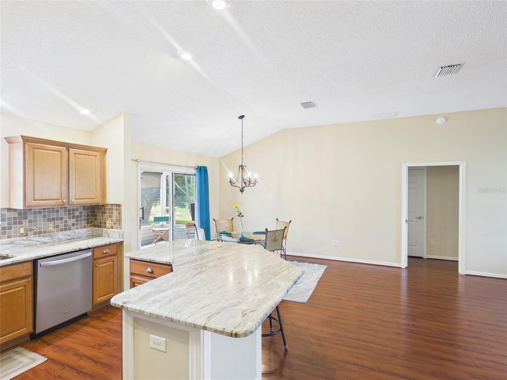 2297 Welcome Way The Villages, FL 32162 - Photo 17 of 36 a kitchen with a sink and cabinets