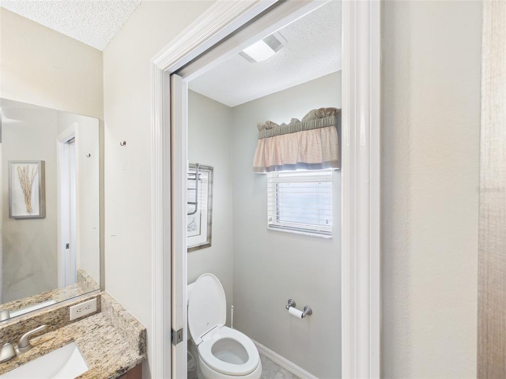 2297 Welcome Way The Villages, FL 32162 - Photo 23 of 36 a bathroom with a toilet sink and tub
