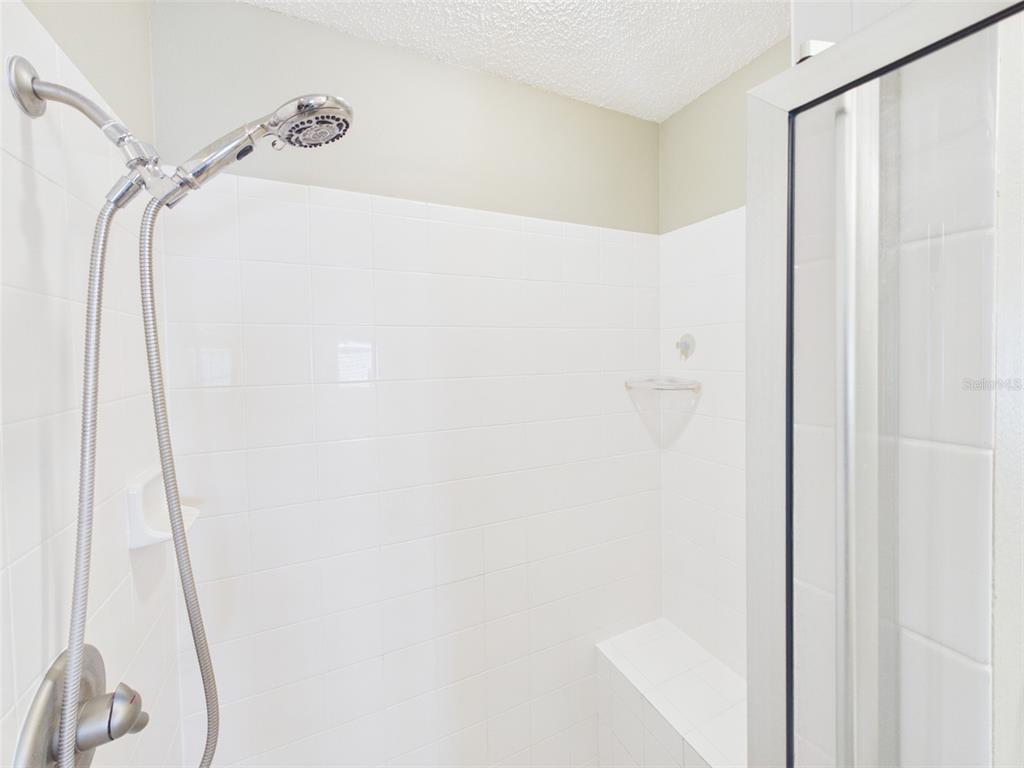 2297 Welcome Way The Villages, FL 32162 - Photo 24 of 36 a bathroom with a shower