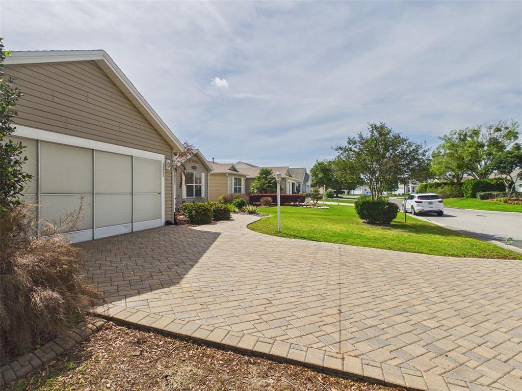 2297 Welcome Way The Villages, FL 32162 - Photo 3 of 36 a view of a backyard
