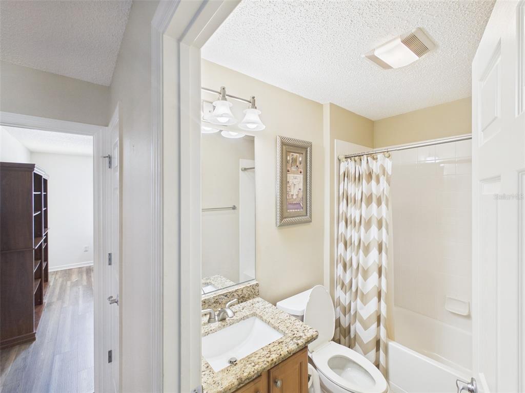 2297 Welcome Way The Villages, FL 32162 - Photo 31 of 36 a bathroom with a bathtub shower sink and toilet