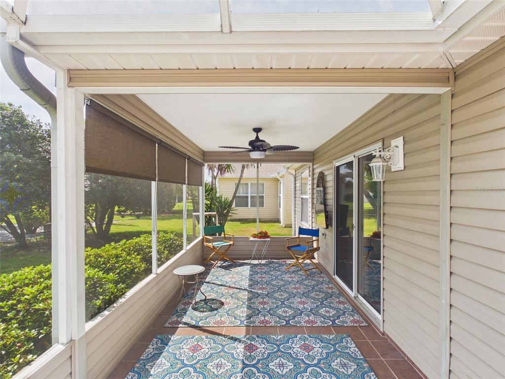 2297 Welcome Way The Villages, FL 32162 - Photo 8 of 36 a living room with large windows