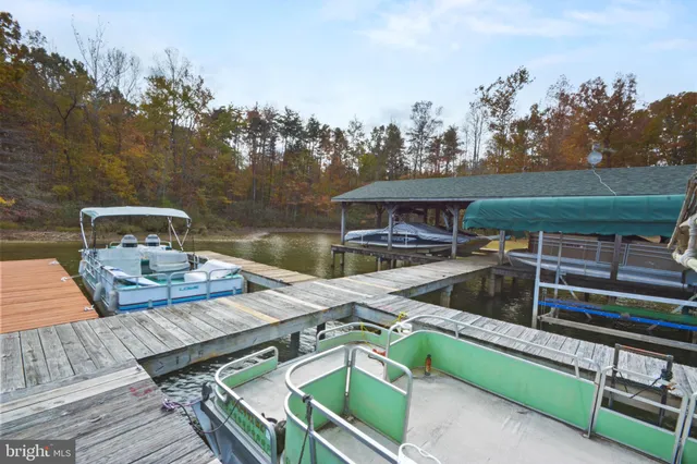 swimming pool view with a seating space
