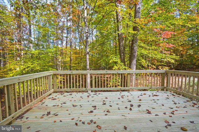 a view of balcony with wooden floor