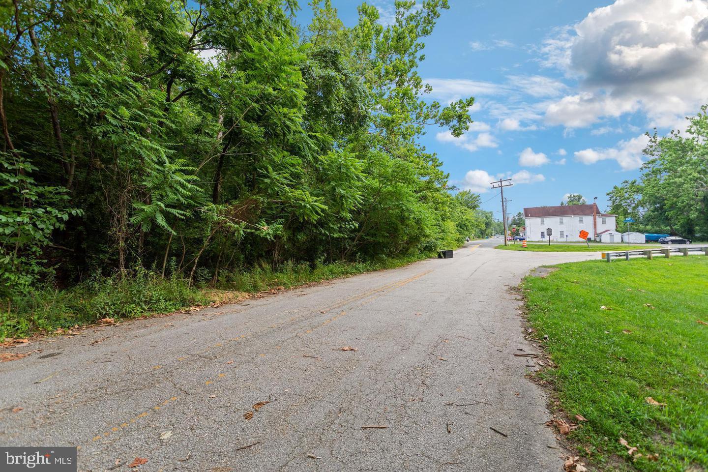 9005 Backlick Road Fort Belvoir, VA 22060 - Photo 18 of 25 a view of a street with a yard