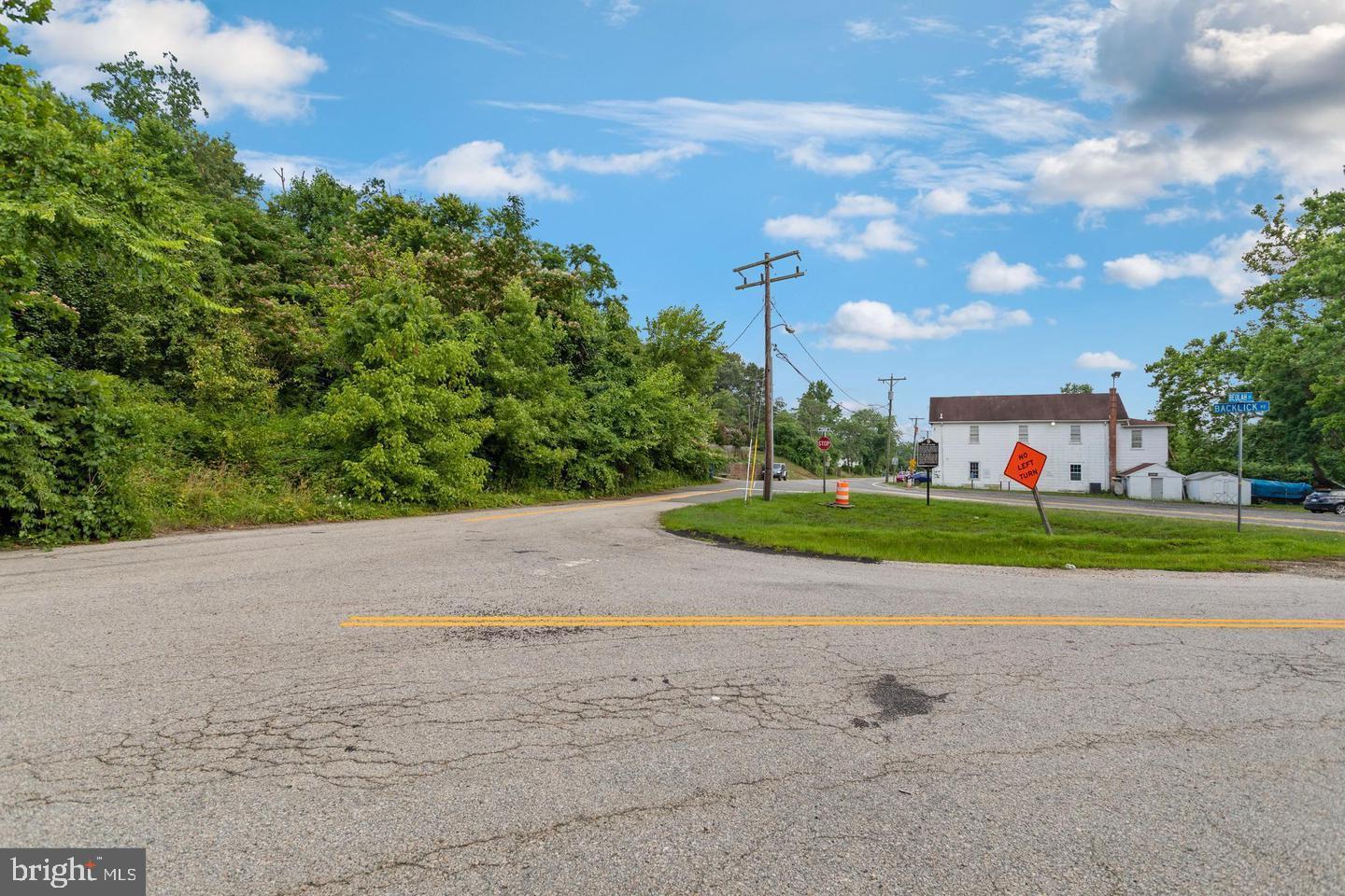 9005 Backlick Road Fort Belvoir, VA 22060 - Photo 22 of 25 a view of road with grass and trees