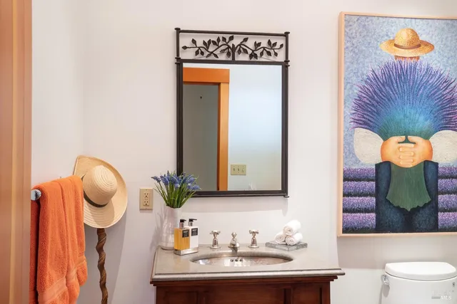 a bedroom with bed and wooden floor