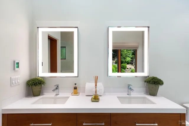 a white bath tub sitting next to a window