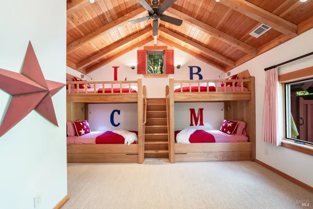 a living room with furniture and flat screen tv