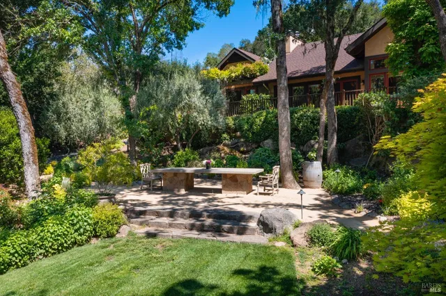 a view of a swimming pool with sitting area