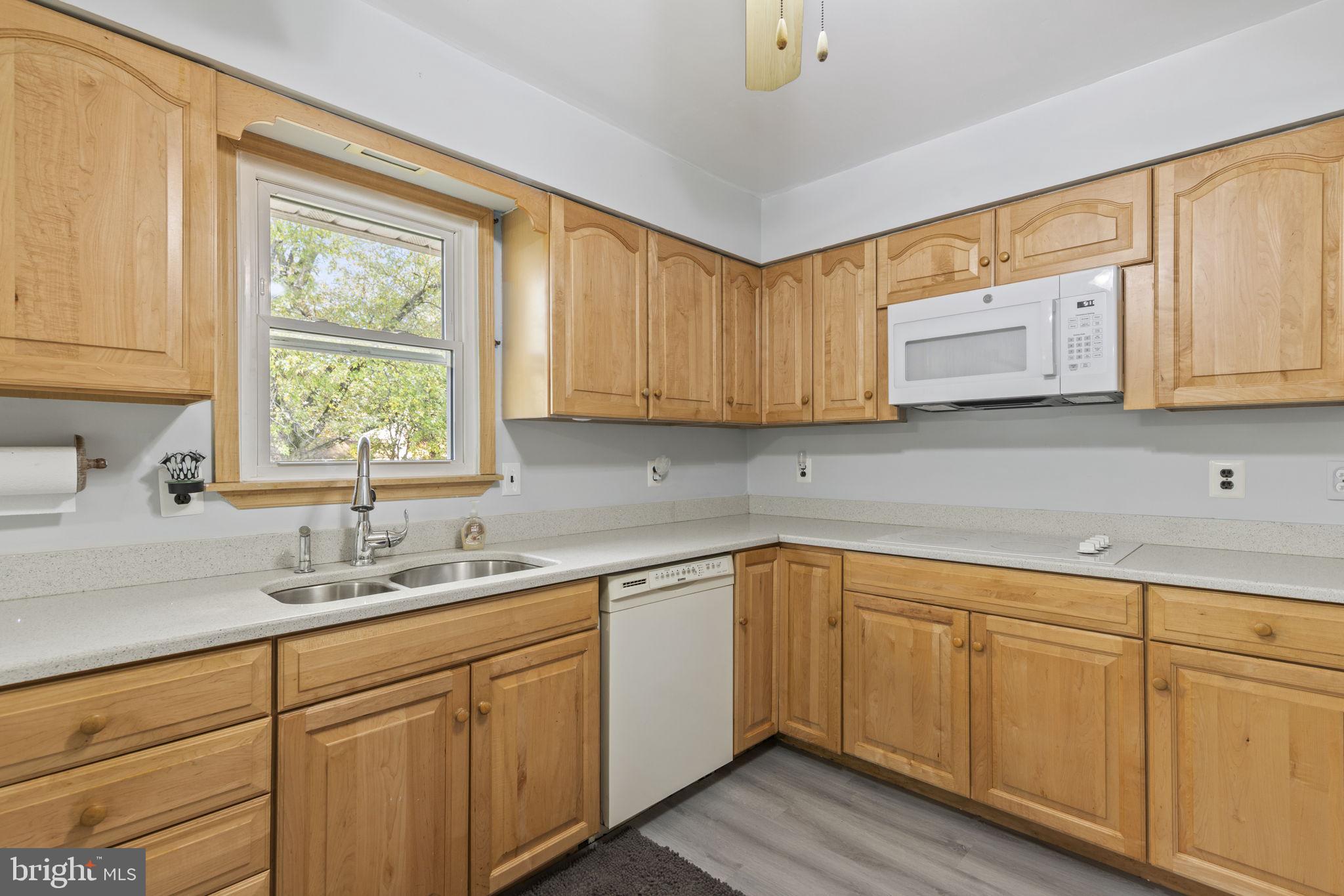413 Magnolia Road Edgewood, MD 21040 - Photo 11 of 49 a kitchen with cabinets appliances a sink and a window