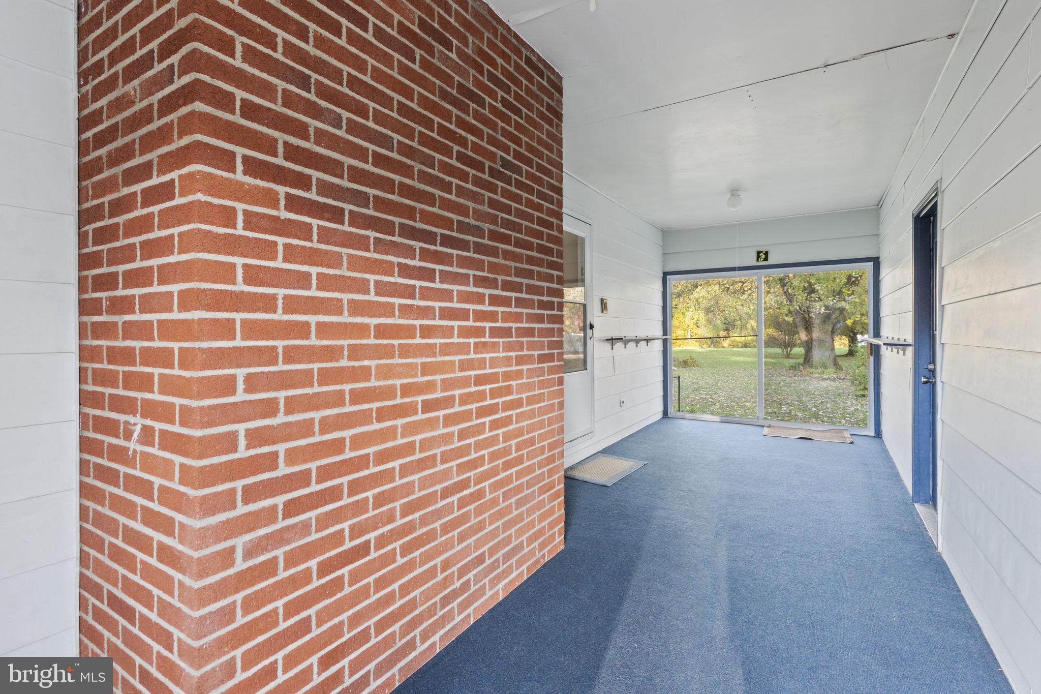 413 Magnolia Road Edgewood, MD 21040 - Photo 14 of 49 a view of an empty room with a balcony