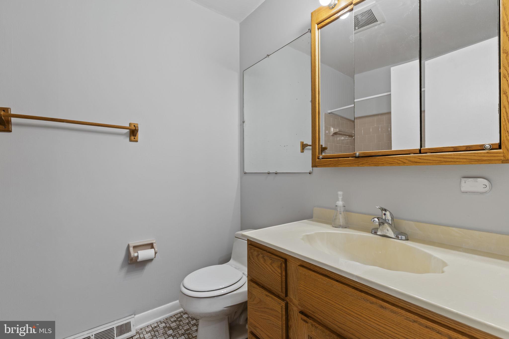 413 Magnolia Road Edgewood, MD 21040 - Photo 18 of 49 a bathroom with a sink and a toilet