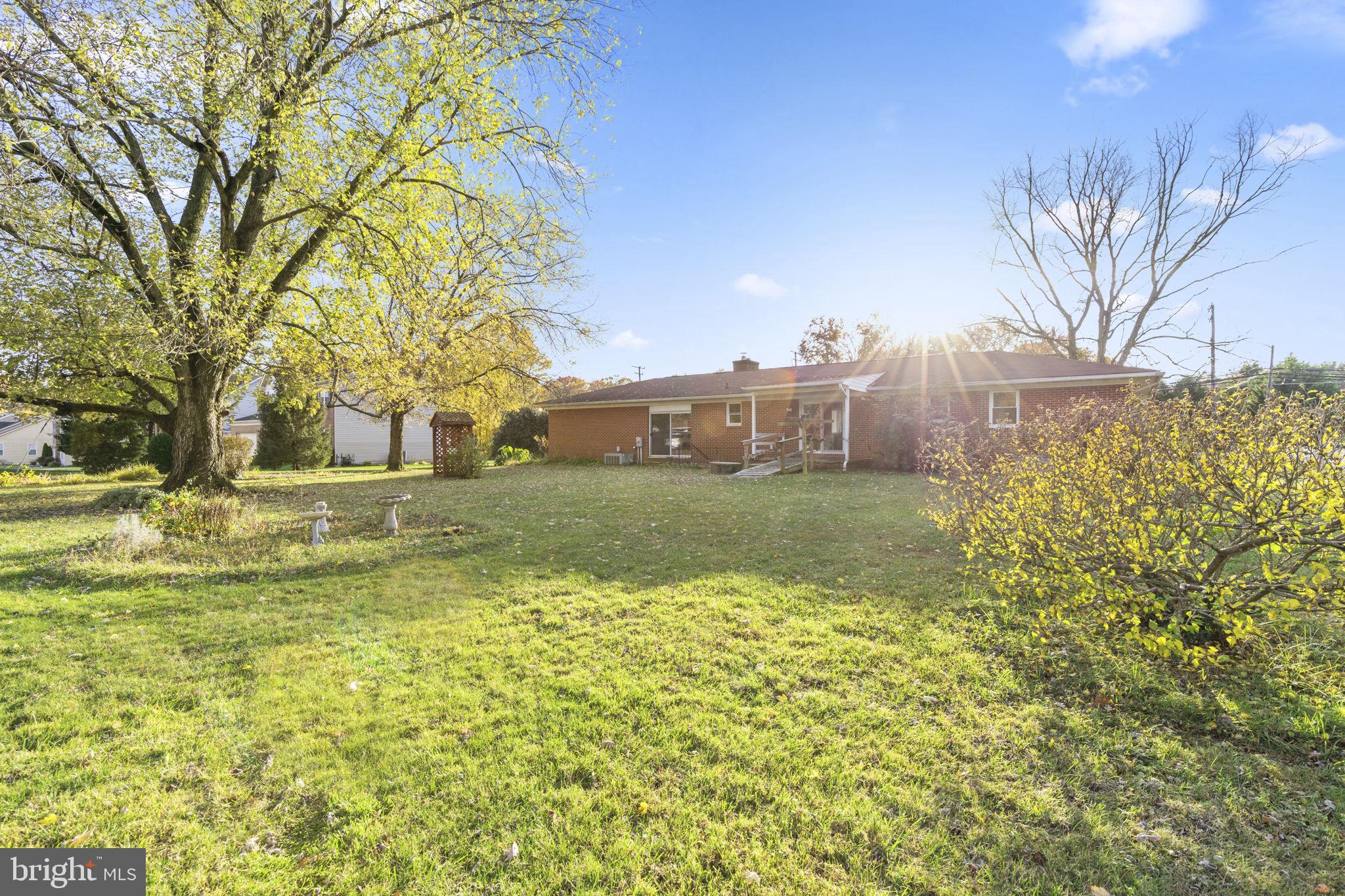 413 Magnolia Road Edgewood, MD 21040 - Photo 33 of 49 a view of a big yard with plants and large trees