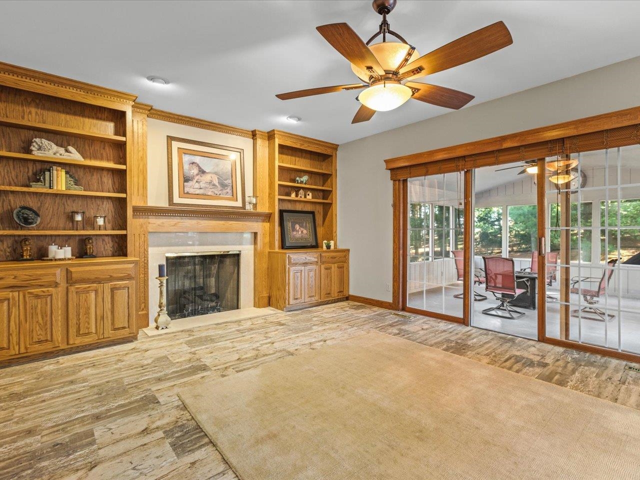 11575 Aberdeen Road Belvidere, IL 61008 - Photo 19 of 46 a view of an empty room with a fireplace and a large window