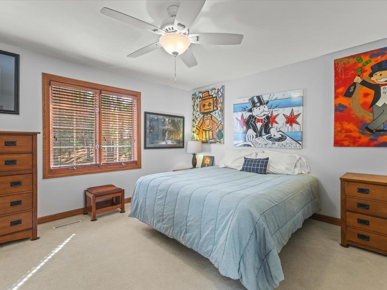 11575 Aberdeen Road Belvidere, IL 61008 - Photo 27 of 46 a bedroom with a bed and a chandelier