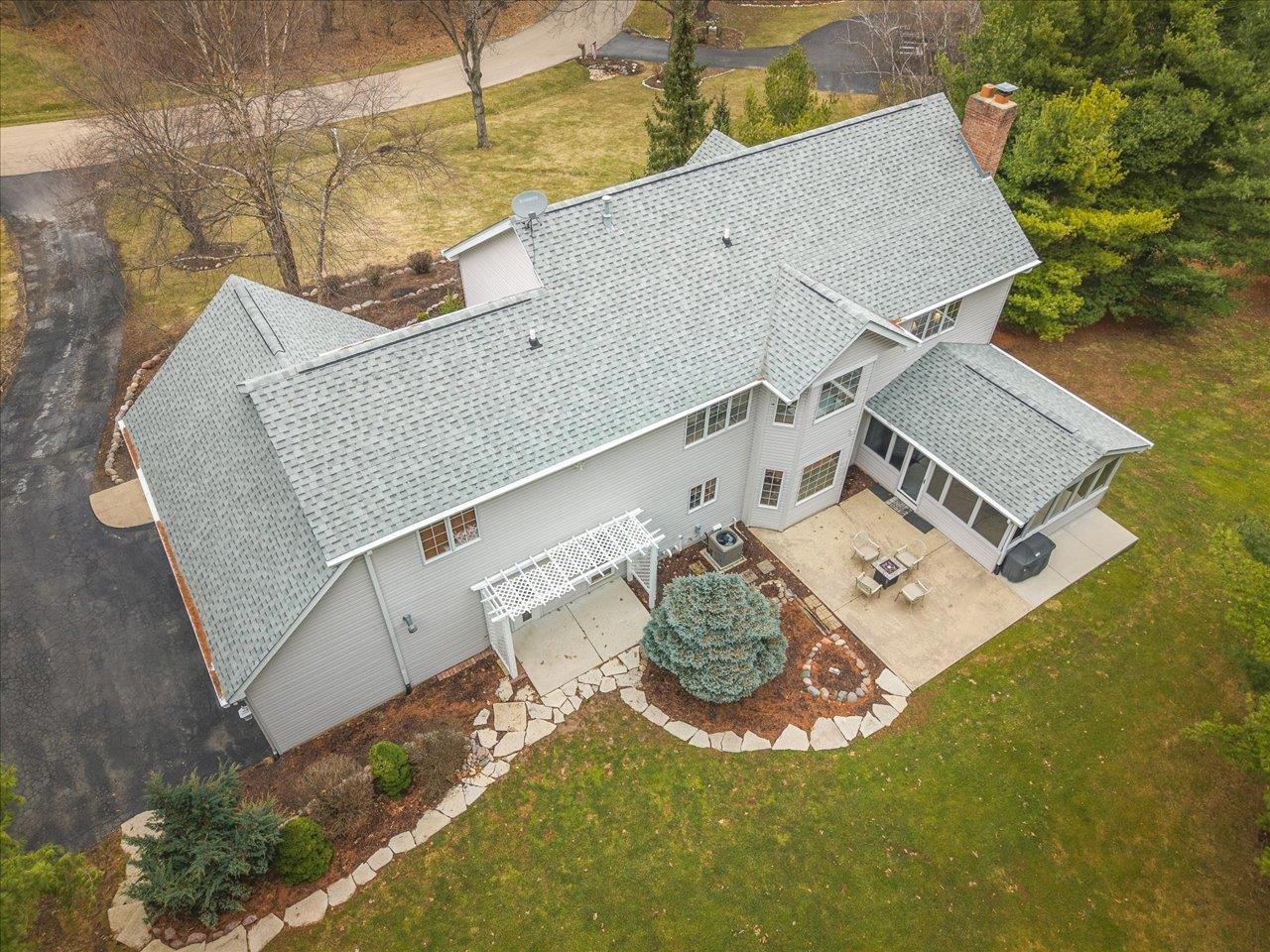 11575 Aberdeen Road Belvidere, IL 61008 - Photo 3 of 46 an aerial view of a house with garden space and a patio