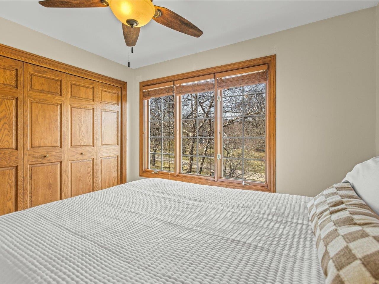 11575 Aberdeen Road Belvidere, IL 61008 - Photo 32 of 46 a bedroom with a large bed and a large window