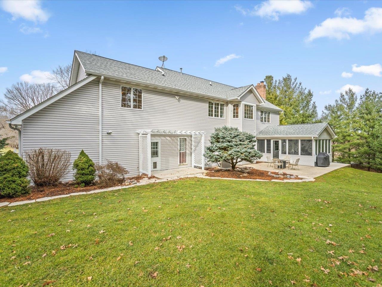 11575 Aberdeen Road Belvidere, IL 61008 - Photo 35 of 46 a front view of a house with a garden and plants