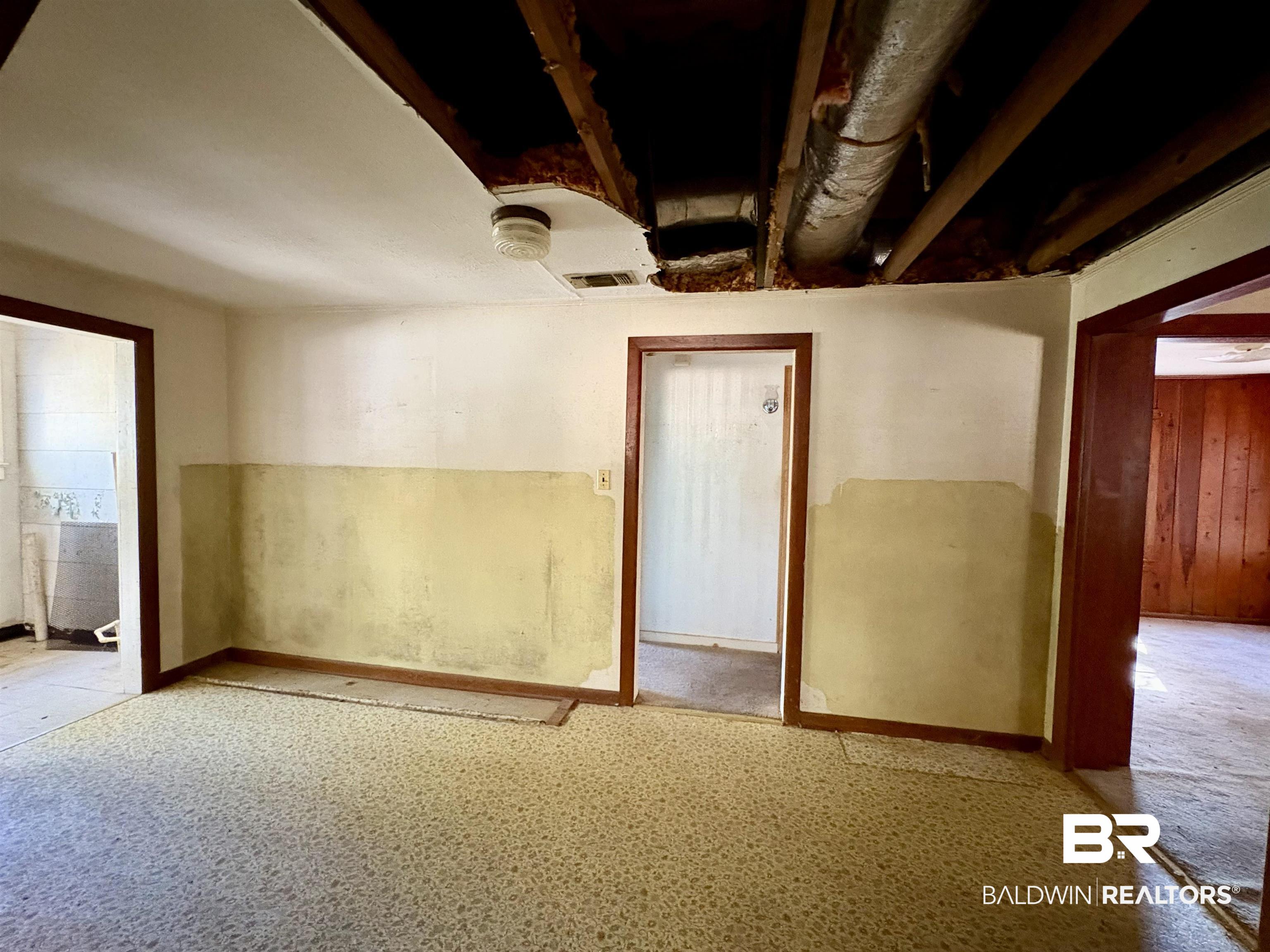 4060 Dickson Lane Mobile, AL 36618 - Photo 6 of 16 Unfurnished room featuring wooden walls and baseboards