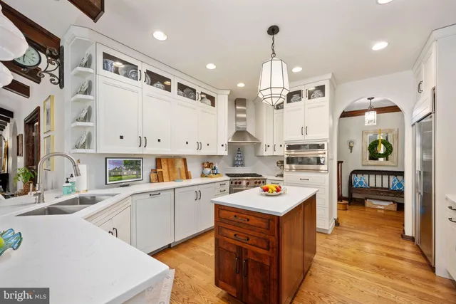a bathroom with a toilet a sink and a shower