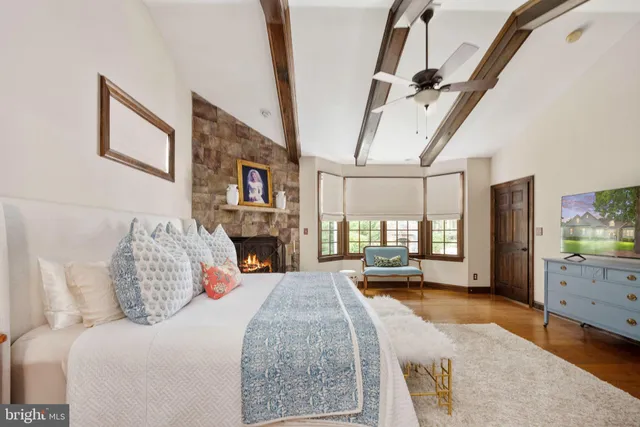 a living room with furniture and large windows