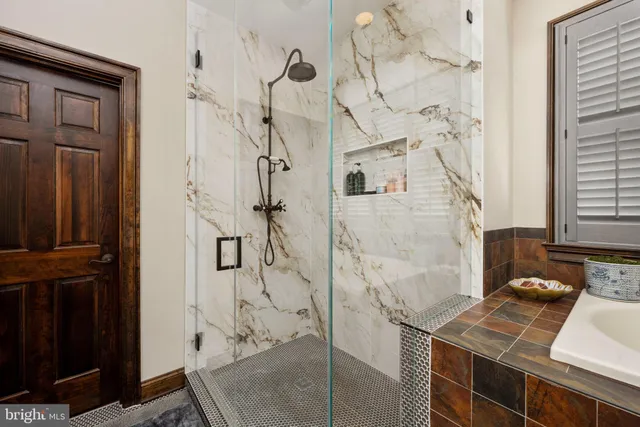 a spacious bedroom with a bed and a couch