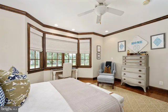 a view of kitchen with kitchen island stainless steel appliances refrigerator stove dining table and chairs