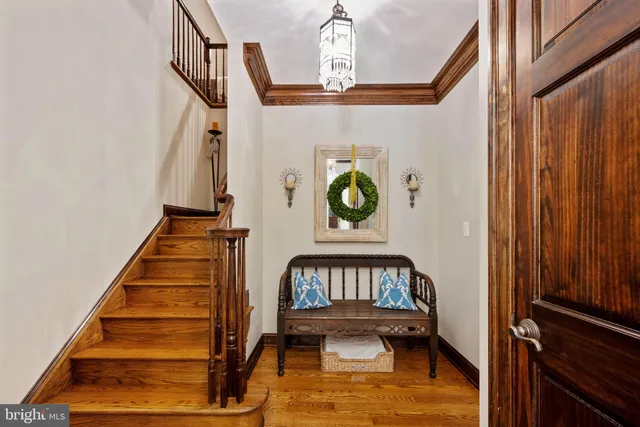 a view of a patio with a table chairs and a floor to ceiling window