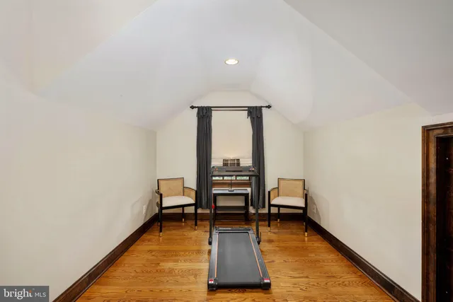 a view of a chairs and fire pit in the patio