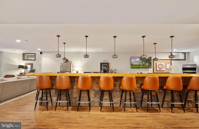 a view of a patio with a table and chairs under an umbrella