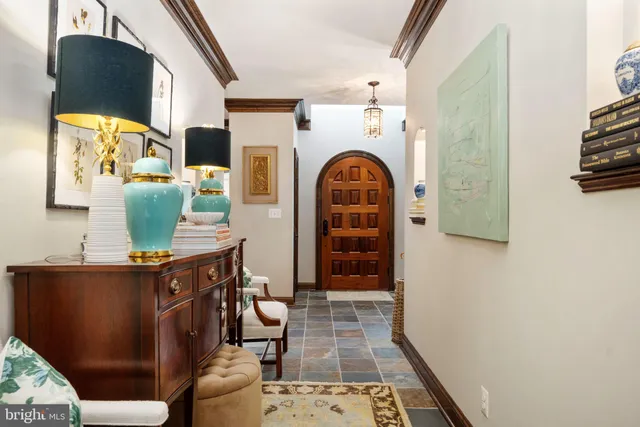 a living room with furniture ceiling fan and a window
