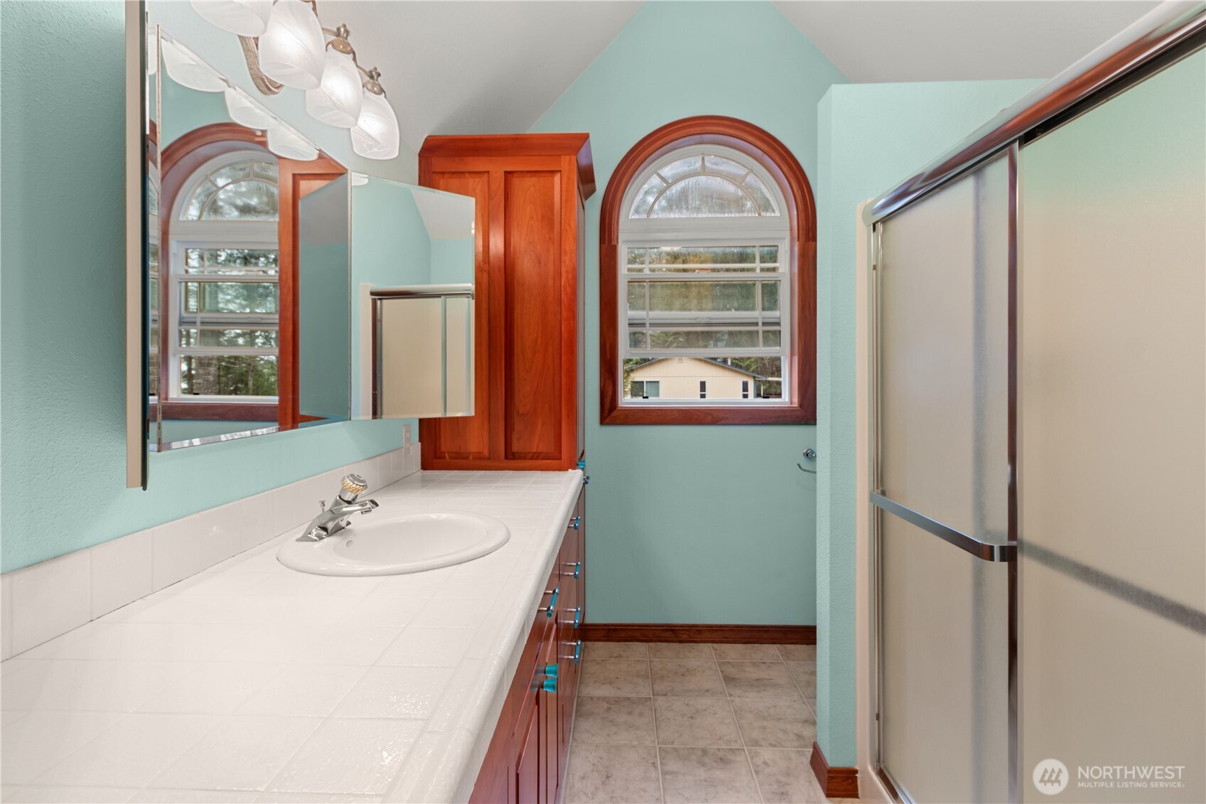 70 Rim View Place Hoodsport, WA 98548 - Photo 17 of 35 a bathroom with a double vanity sink and a mirror