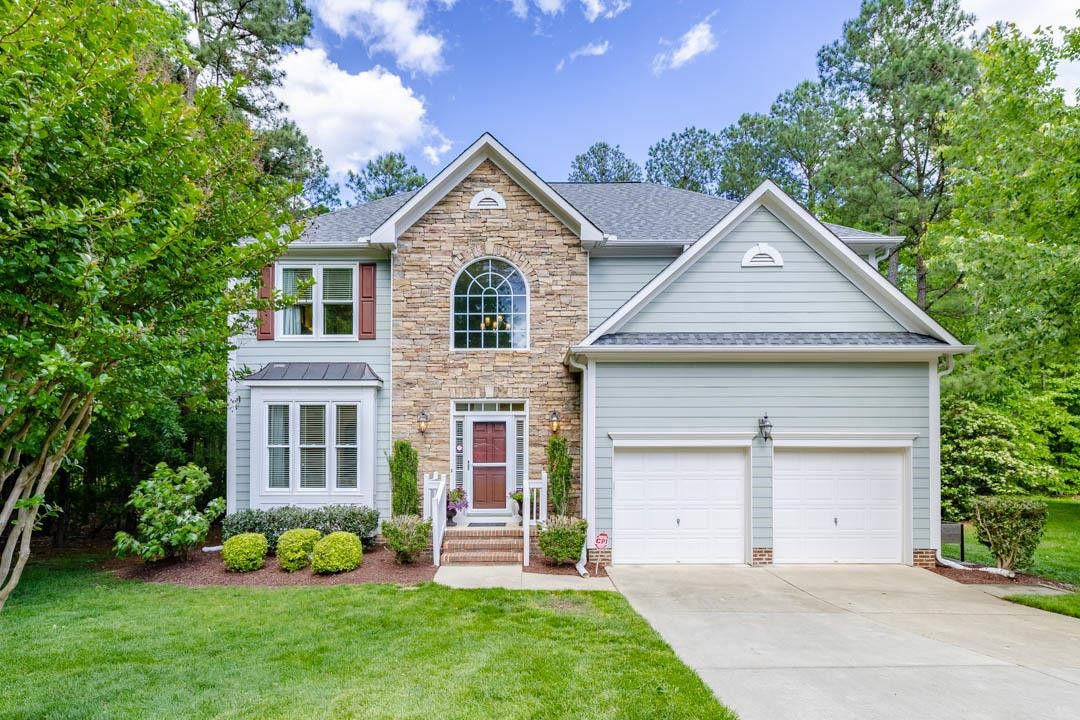 front view of a house with a yard