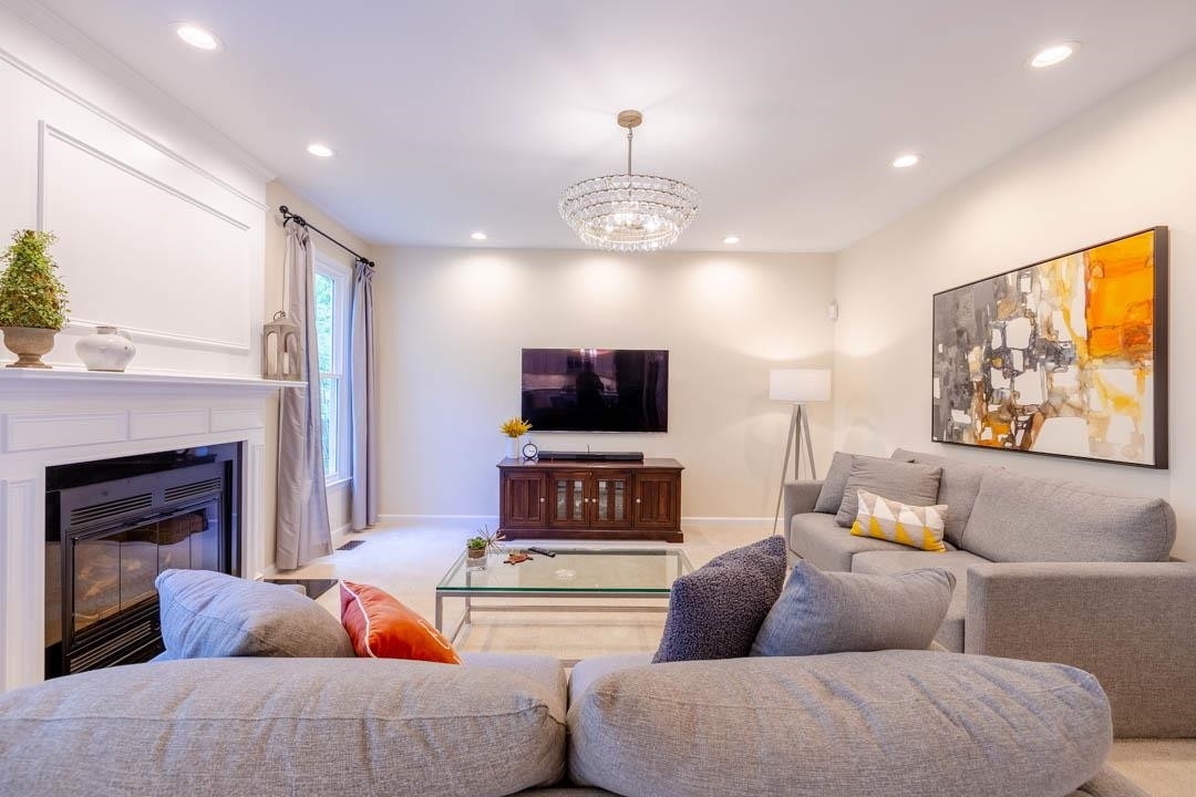 7402 Leapale Lane Durham, NC 27713 - Photo 15 of 41 a living room with furniture and a flat screen tv