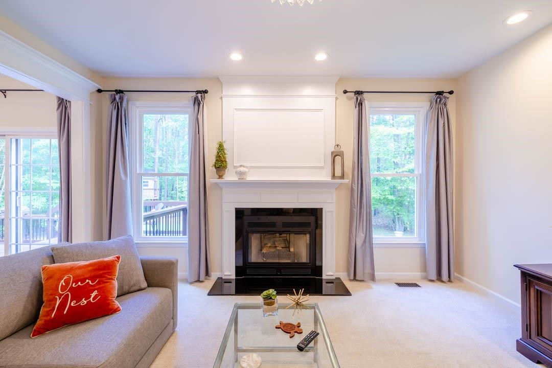 7402 Leapale Lane Durham, NC 27713 - Photo 17 of 41 a living room with furniture and a fireplace