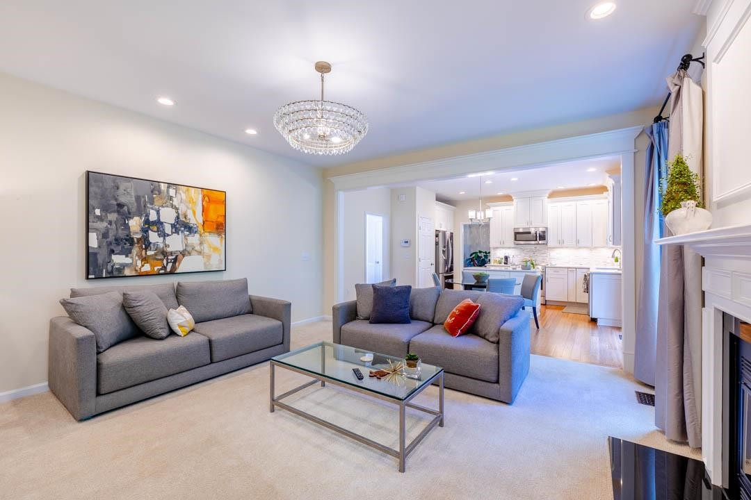 7402 Leapale Lane Durham, NC 27713 - Photo 18 of 41 a living room with furniture kitchen view and a large window
