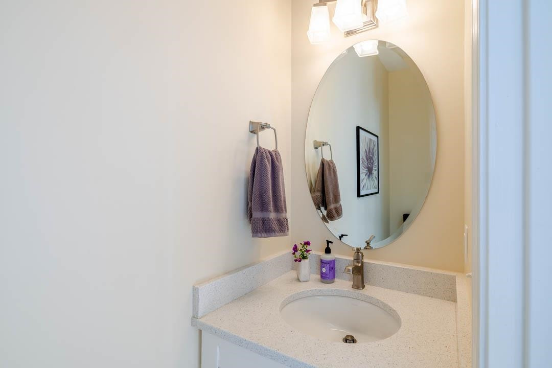 7402 Leapale Lane Durham, NC 27713 - Photo 19 of 41 a bathroom with a sink and a mirror