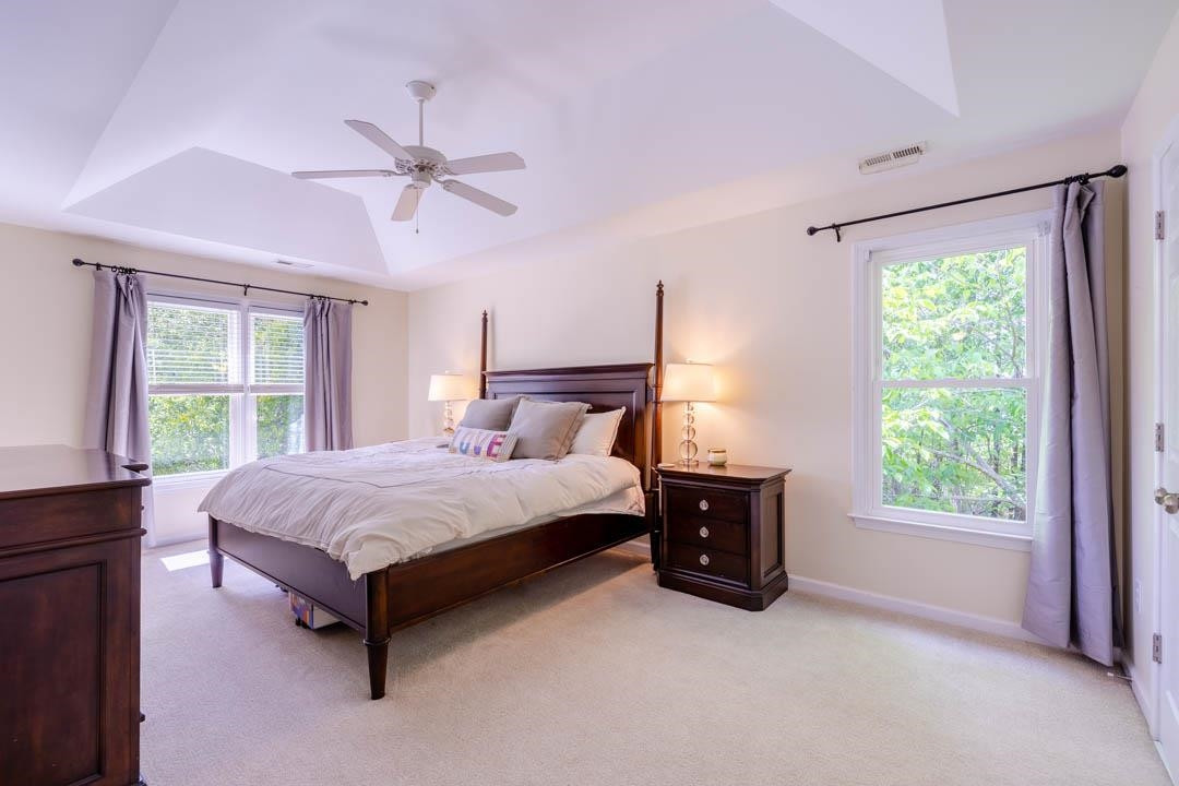 7402 Leapale Lane Durham, NC 27713 - Photo 21 of 41 a spacious bedroom with a bed and window