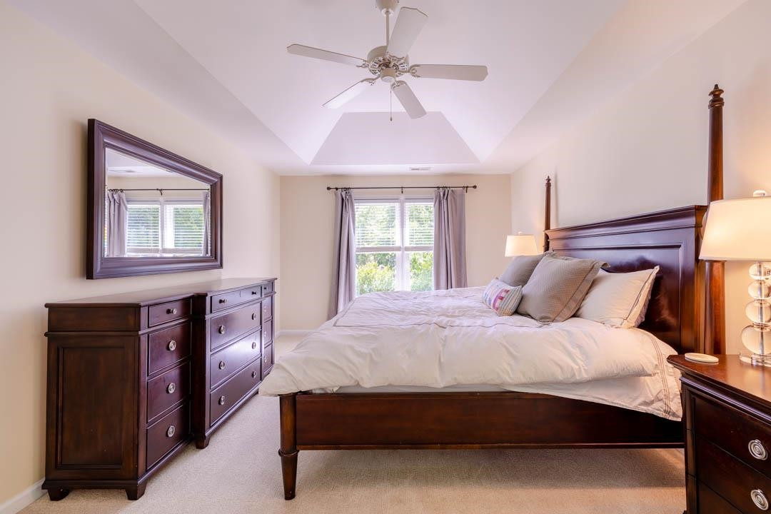 7402 Leapale Lane Durham, NC 27713 - Photo 22 of 41 a bedroom with a bed and a window