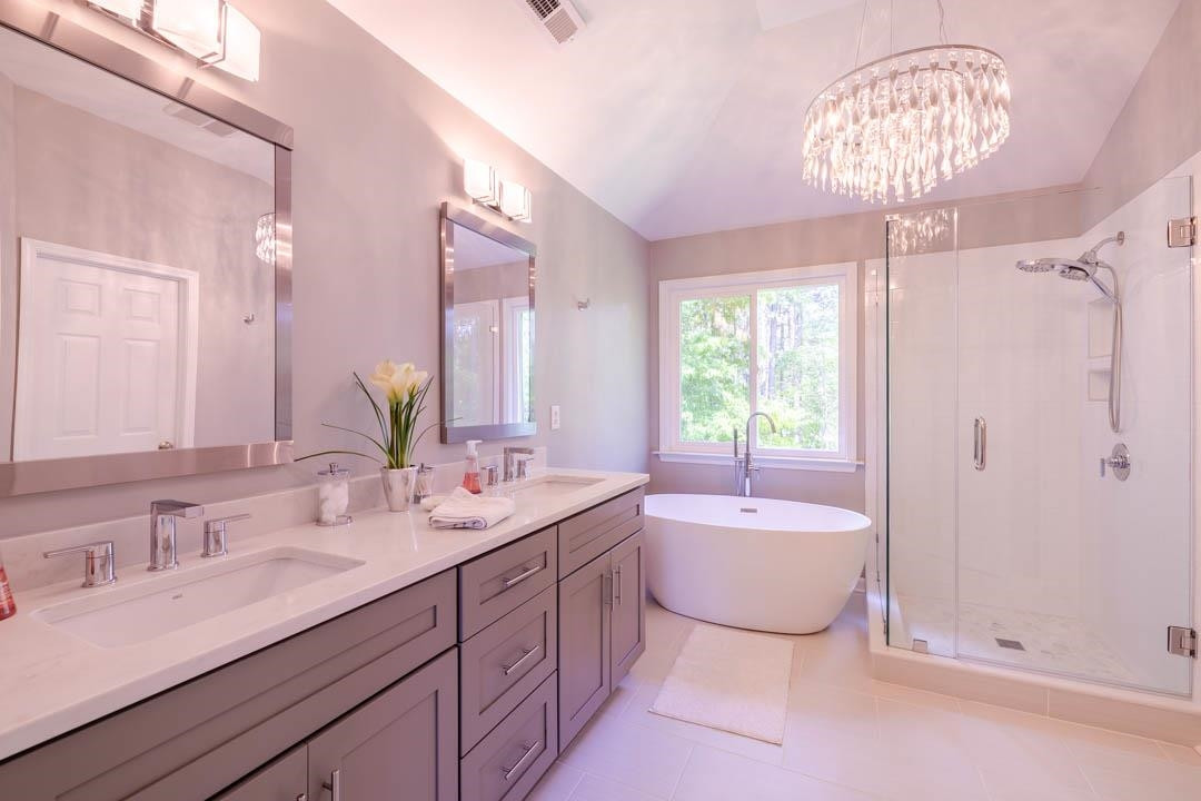 7402 Leapale Lane Durham, NC 27713 - Photo 24 of 41 a spacious bathroom with a double vanity sink mirror and bathtub