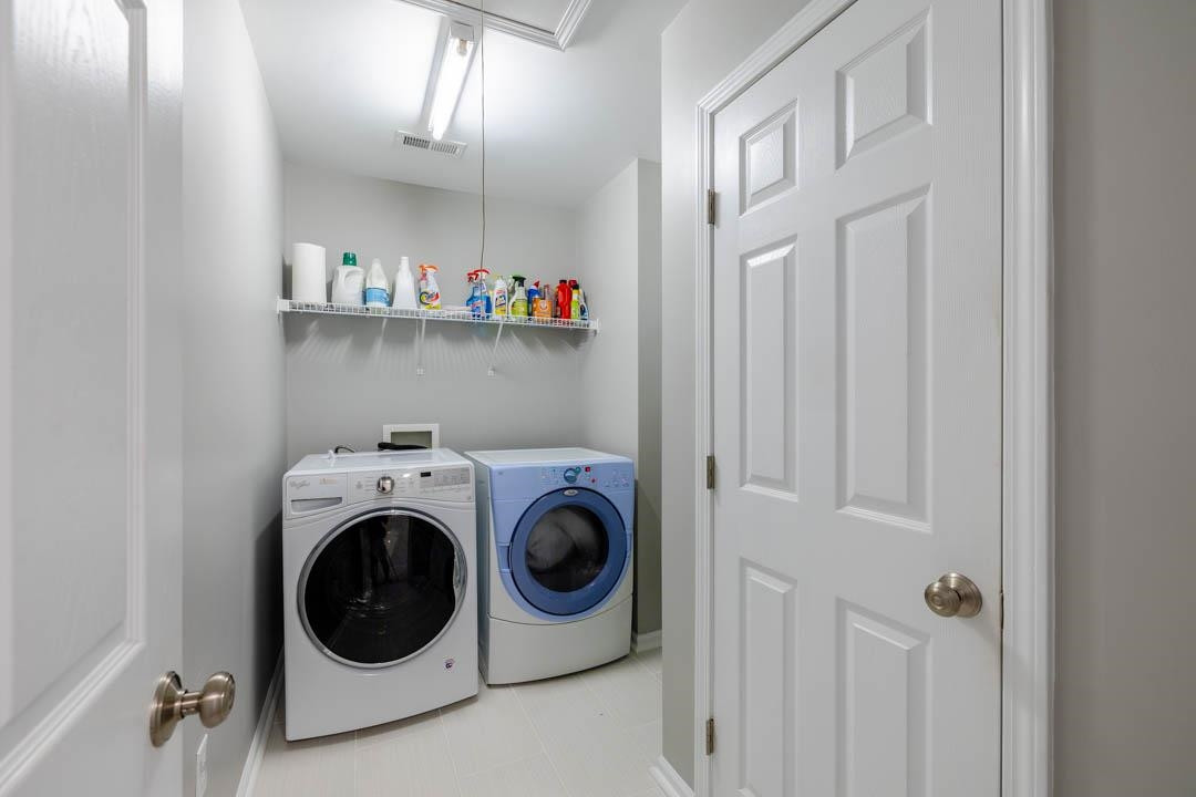 7402 Leapale Lane Durham, NC 27713 - Photo 29 of 41 a utility room with dryer and washer