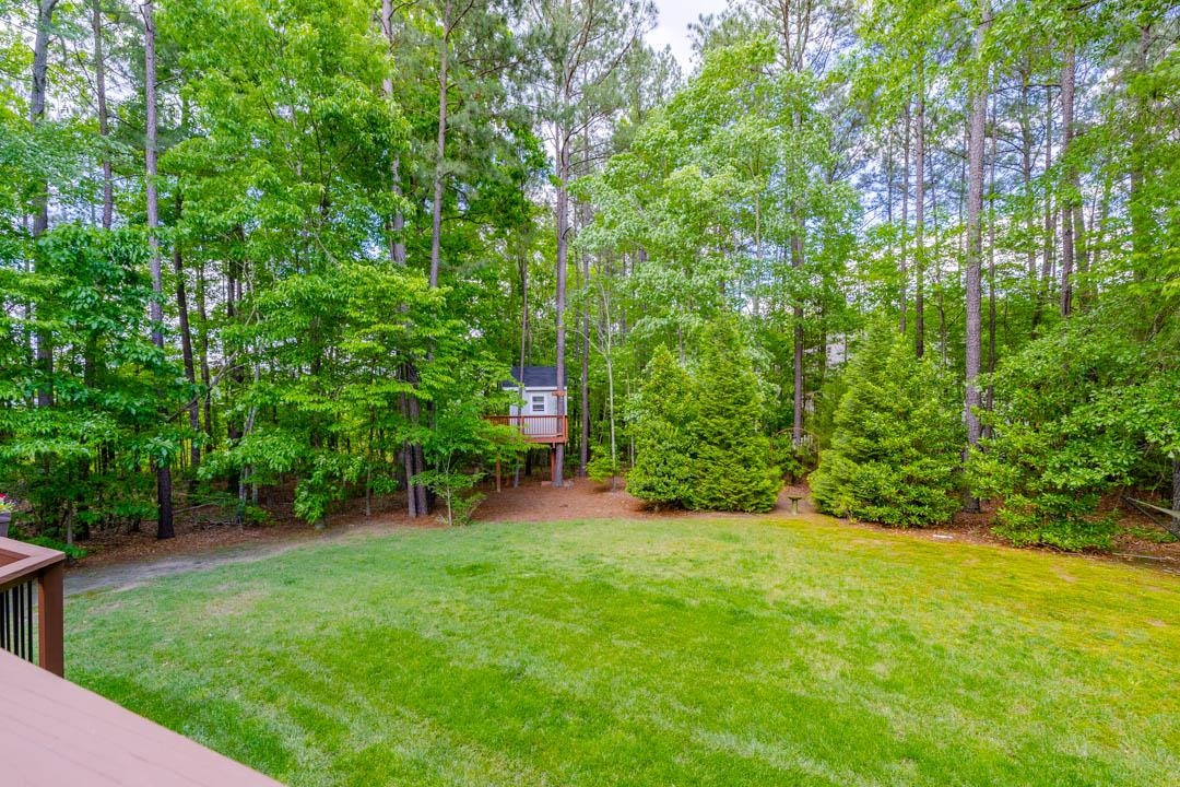 7402 Leapale Lane Durham, NC 27713 - Photo 32 of 41 a view of a backyard with a garden