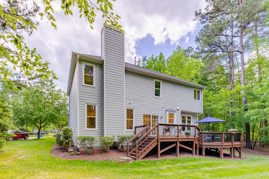 7402 Leapale Lane Durham, NC 27713 - Photo 33 of 41 a view of a house with backyard porch and sitting area