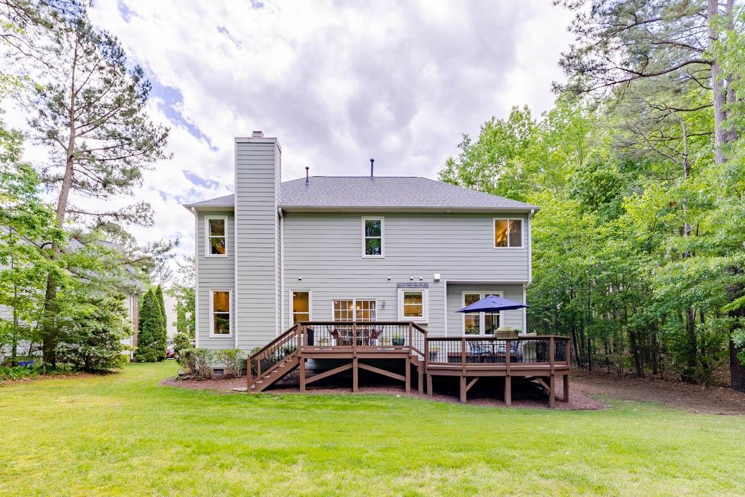 7402 Leapale Lane Durham, NC 27713 - Photo 34 of 41 a view of a house with a yard and sitting area