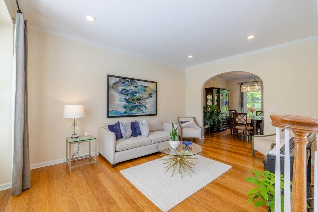7402 Leapale Lane Durham, NC 27713 - Photo 4 of 41 a living room with furniture and a wooden floor