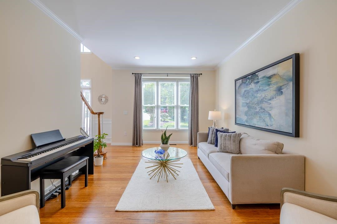 7402 Leapale Lane Durham, NC 27713 - Photo 6 of 41 a living room with furniture and a piano