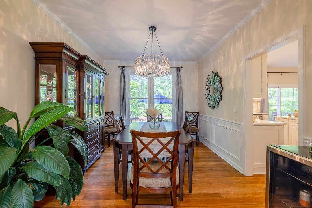 7402 Leapale Lane Durham, NC 27713 - Photo 7 of 41 a view of a dining room with furniture window and wooden floor