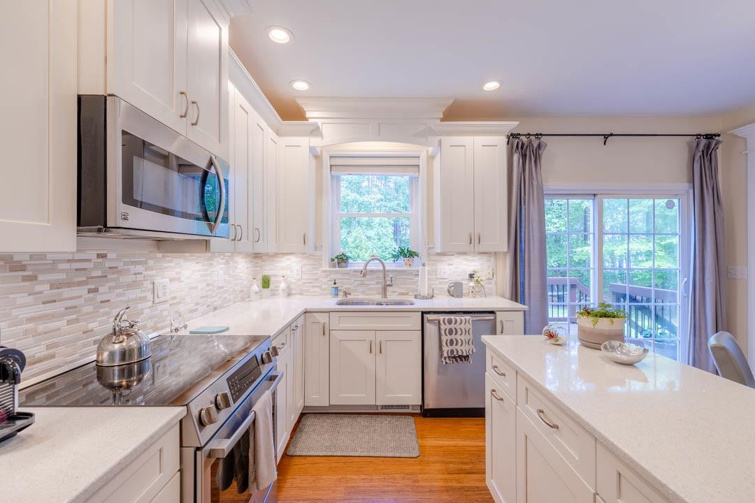 7402 Leapale Lane Durham, NC 27713 - Photo 9 of 41 a kitchen with a sink stove and cabinets