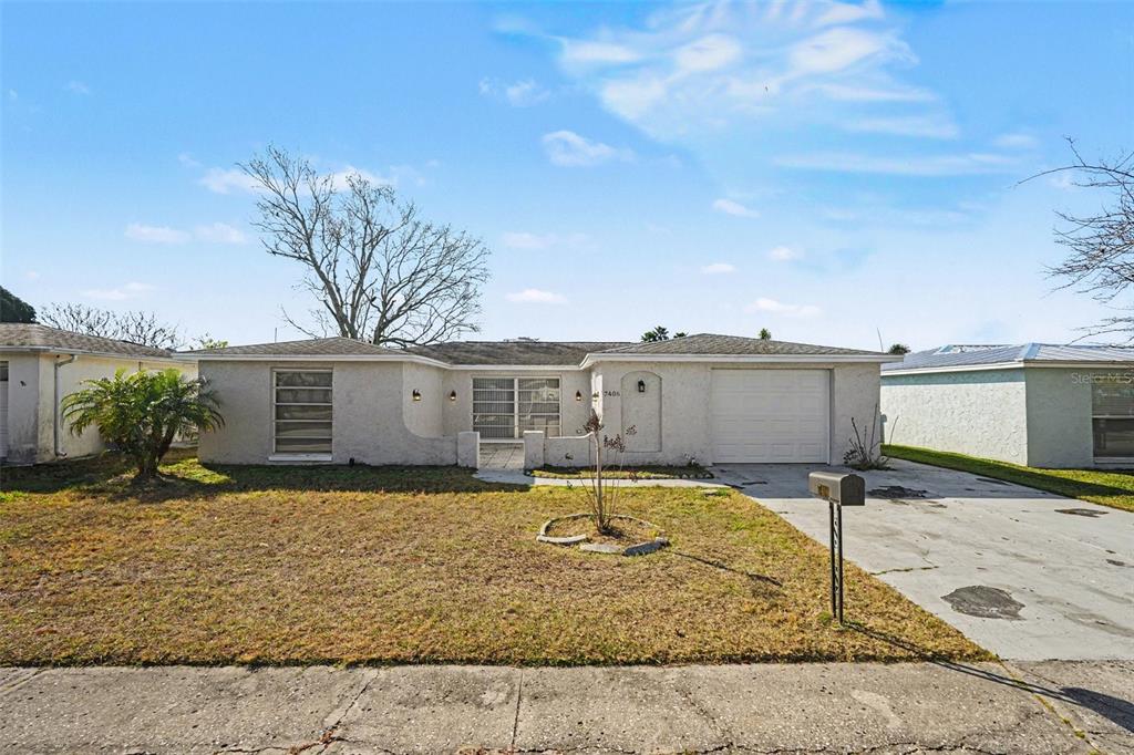 7406 Westwind Drive Port Richey, FL 34668 - Photo 1 of 1 a swimming pool view with a seating space